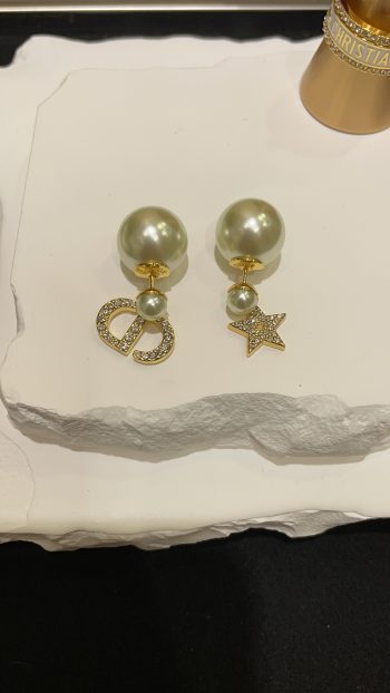 Dior's new Tribales double earrings featuring full diamonds, stars and pearls